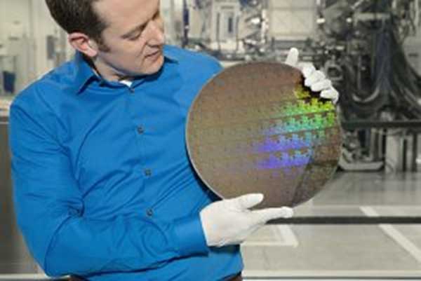 IBM Research scientist Nicolas Loubet holds a wafer of chips with 5nm silicon nanosheet transistors manufactured using an industry-first process that can deliver 40 percent performance enhancement at fixed power, or 75 percent power savings at matched performance. Press release link (Photo Credit: Connie Zhou)