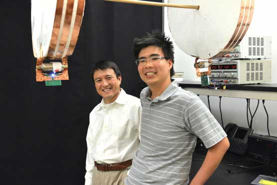 Professor Shanhui Fan (left) and graduate student Sid Assawaworrarit have developed a device that can wirelessly charge a moving object at close range. The technology could be used to charge electric cars on the highway, or medical implants and cellphones as you walk nearby. (Image credit: Mark Shwartz/Stanford University)