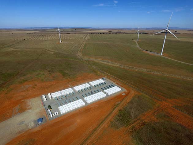 The Hornsdale Wind Farm with the Tesla battery installation in the foreground. (Source: David Clarke @ flickr)