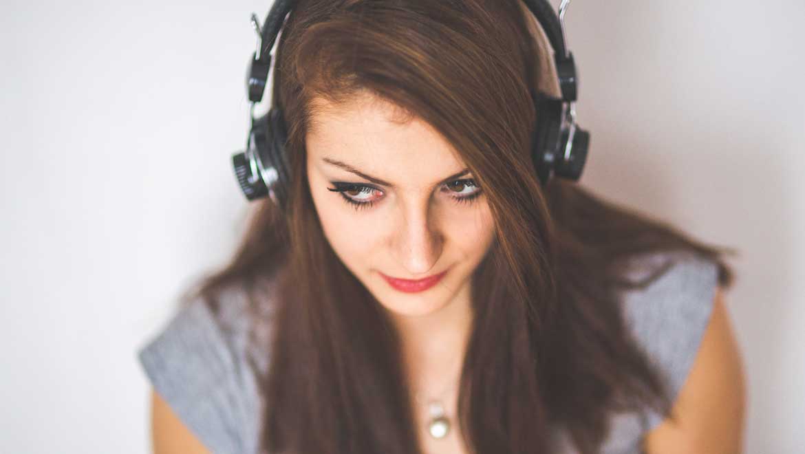  Young girl listening to music.