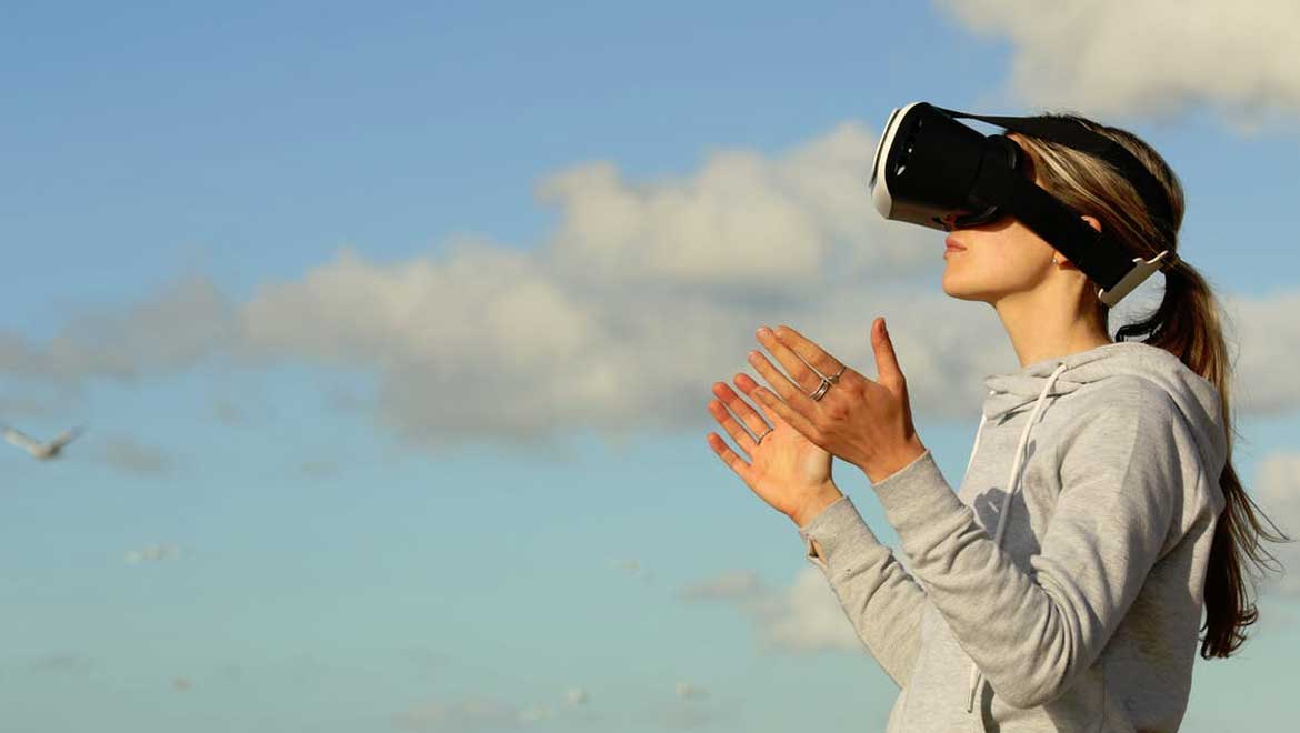 Side view of someone outside using virtual reality