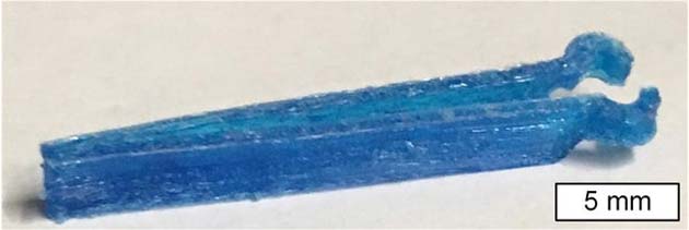 Adding a small amount of antimicrobial dye to cellulose acetate ink allowed researchers to 3-D-print a pair of antimicrobial surgical tweezers(Credit: MIT)